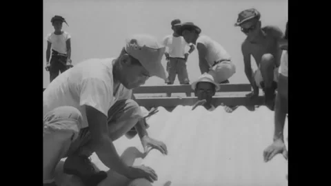 VIETNAM - 1960s - Vietnamese workers installing roof using slate roofing from Stock Footage 340577442
