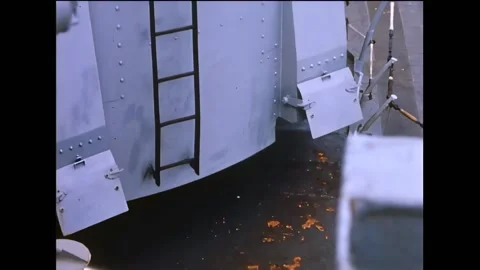 VIETNAM - 1966 - Empty shell casings are being ejected from the chutes as naval Stock Footage 316681821