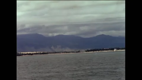 VIETNAM - 1966 - Phosphorus shell exploding on beach area as smoke rises from Stock Footage 316681773