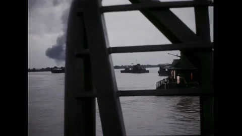 VIETNAM - 1967 - A shell explodes far from the Mekong River, sending a pillar of 動画素材 316679006