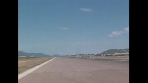 VIETNAM - 1968: Air Force Training - Light Aircraft Climbs from Airfield Stock Footage 343935750