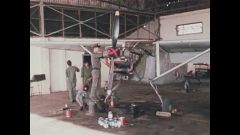 VIETNAM - 1968: Air Force Training - Mechanics Work on Exposed Engine Stock Footage 343935785