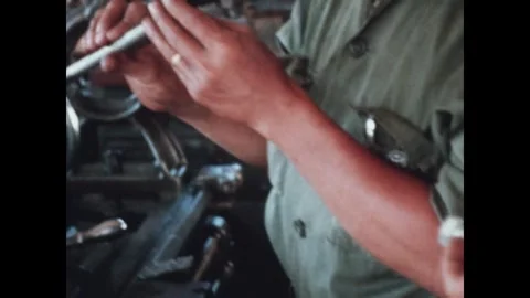 VIETNAM - 1968: hands, tools and a parked truck 動画素材 341670237