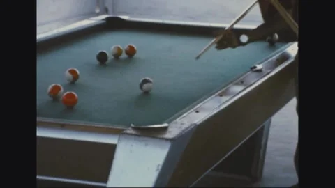 VIETNAM - 1968: Pool Table Match - Cue Strokes In Over a Scattered Table Stock Footage 344004881