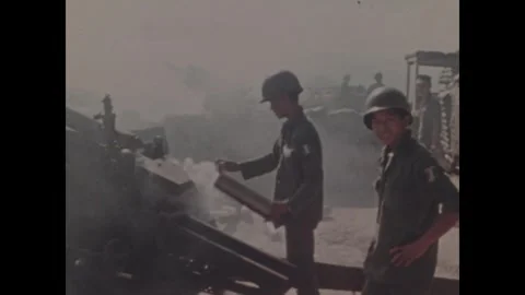 VIETNAM - 1970: Firebase Withdrawal - Muzzle blast rocks a hilltop gun crew 스톡 동영상 344000536