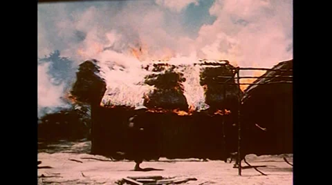 Vietnam War - Burning Village Fleeing Civilians  Stock Footage
