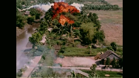 Vietnam War - Flight in low altitude over vietnam. Napal airstrike on village. Stock Footage 91247464