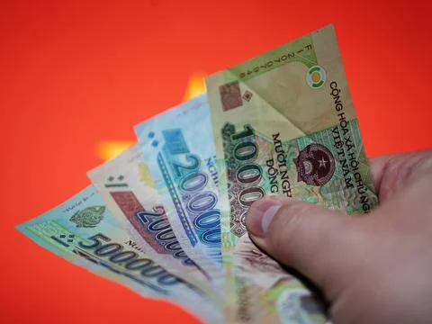 Vietnamese Currency Notes Held in a Hand Stock Photos