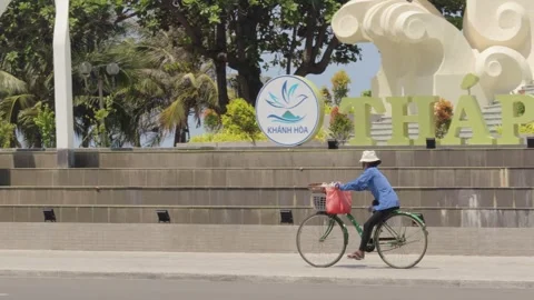 Vietnamese cyclist on the move Stock Footage 241492325