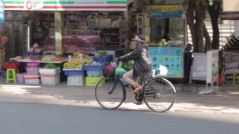 Vietnamese cyclist on the move Video stock 241492825