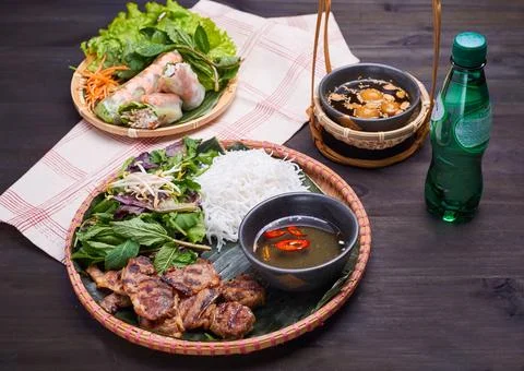 Vietnamese dish set with spring rolls on the dark table Stock Photos
