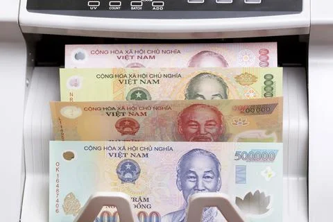 Vietnamese dong in the counting machine Stock Photos