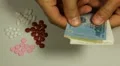 Vietnamese Dong VND, Counting Drugs and Money, Health Care, Colorful Pills HD Footage