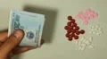 Vietnamese Dong VND, Counting Drugs and Money, Health Care, Colorful Pills HD Footage