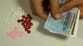 Vietnamese Dong VND, Counting Drugs and Money, Health Care, Colorful Pills HD Footage