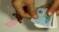 Vietnamese Dong VND, Counting Drugs and Money, Health Care, Colorful Pills HD Footage