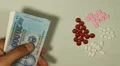 Vietnamese Dong VND, Counting Drugs and Money, Health Care, Colorful Pills HD Footage