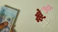 Vietnamese Dong VND, Counting Drugs and Money, Health Care, Colorful Pills HD Footage