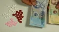 Vietnamese Dong VND, Counting Drugs and Money, Health Care, Colorful Pills HD Footage
