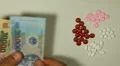Vietnamese Dong VND, Counting Drugs and Money, Health Care, Colorful Pills HD Footage