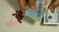 Vietnamese Dong VND, Counting Drugs and Money, Health Care, Colorful Pills HD Footage