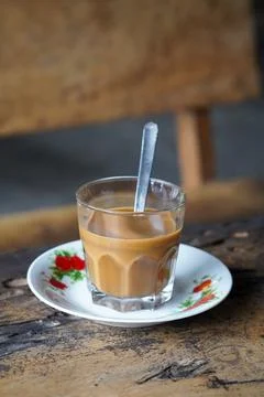 Vietnamese drip coffee made with bold robusta on a wooden table Stock Photos