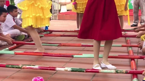 Vietnamese elementary pupils performing bamboo dance with colorful costumes Stock Footage 142180747