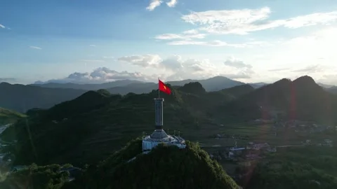 Vietnamese Flag Flying on Lung Cu Flag Tower in Ha Giang, Vietnam Stock Footage 334619404