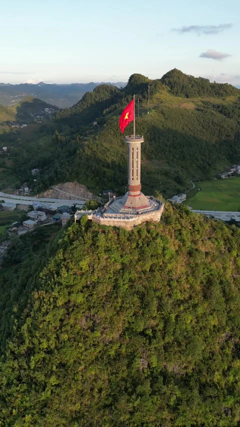 Vietnamese Flag Waving on Lung Cu Flag Tower in Ha Giang, Vietnam Stock Footage 334619595