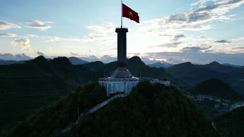 Vietnamese Flag Waving on Lung Cu Flag Tower in Ha Giang, Vietnam Stock Footage 334619702