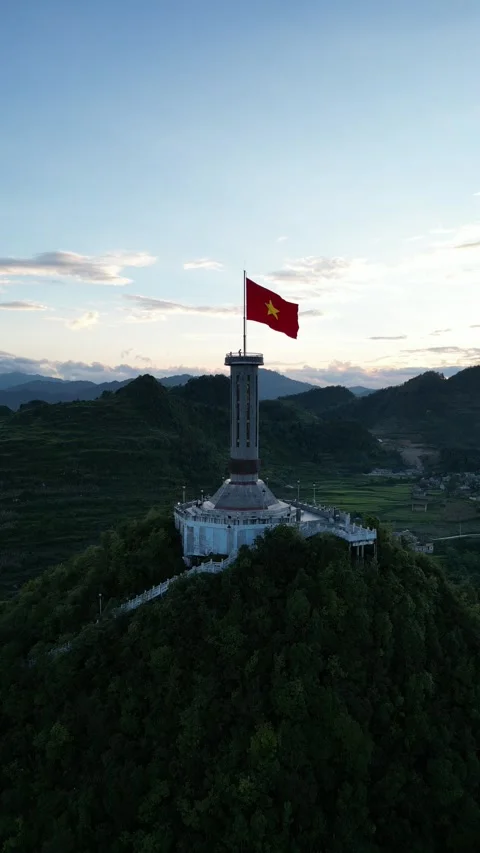 Vietnamese Flag Waving on Lung Cu Flag Tower in Ha Giang, Vietnam Stock Footage 334619752