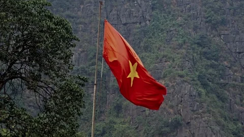 Vietnamese Flag Waving on Mua Cave Mountain Stock Footage 344017038