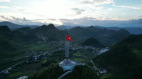Vietnamese Flag Waving Over Lung Cu Flag Tower in Ha Giang, Vietnam Video stock 334619524