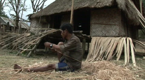 Vietnamese man weaving bamboo Stock Footage