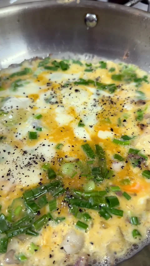 Vietnamese omelet cooking in a pan, authentic local street food Stock Footage 327844845