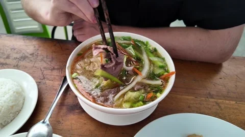 Vietnamese Pho Soup with Beef and Rice Stock Footage 263093059