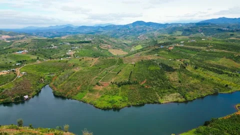 "Vietnamese Serenity: A Mesmerizing 4K Drone Journey Across Tranquil Lakes and M Stock Footage 233409893