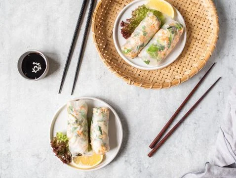 Vietnamese spring rolls and sauce in bowl Stock Photos