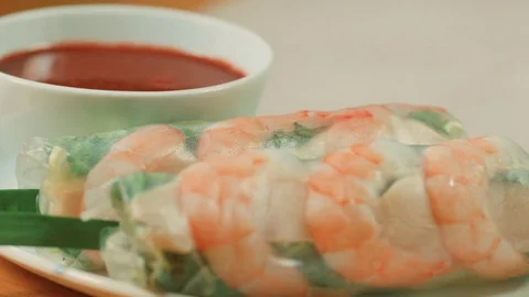 Vietnamese Spring Rolls  on a wooden table Stock Footage 83334156