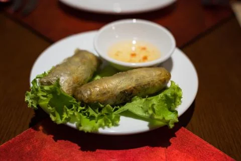 Vietnamese style deep fried spring rolls with dipping sauce Stock Photos
