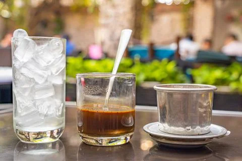 Vietnamese styled filter coffee brewed with condensed milk Stock Photos