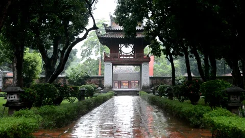 Vietnamese temple entrance while raining (Medium shot) Stock Footage 100314014