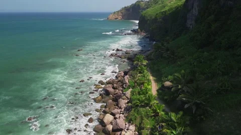 Viev The beach side with waves is bordered hill Stock Footage 289975788