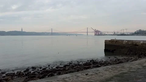 View of 25th April Bridge and Tagus river in Lisbon in December Stock Footage 227130358