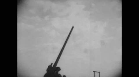 View of 3-4 inch anti-aircraft gun firing Stock Footage