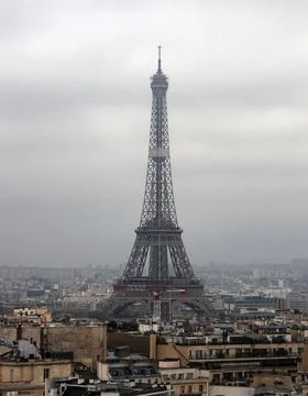 View of the 300-meter metal Eiffel tower from the Arc de Triomphe. Stock Photos