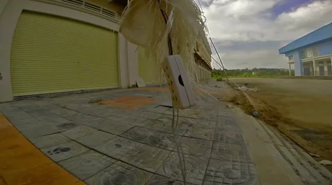 View of abandoned  construction site and electric socket swinging on wire Stock Footage 62298109