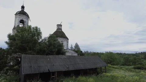 View of an abandoned old white Orthodox temple in the old village Stock Footage 338200409