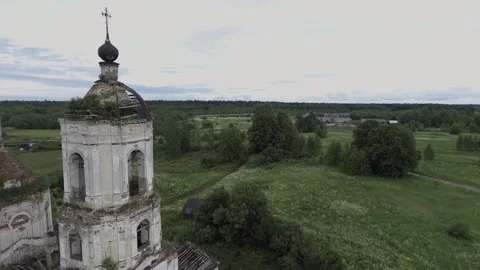 View of an abandoned old white Orthodox temple in the old village Stock Footage 338200423