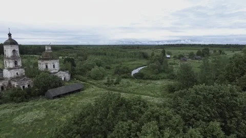 View of an abandoned old white Orthodox temple in the old village Stock Footage 338200435